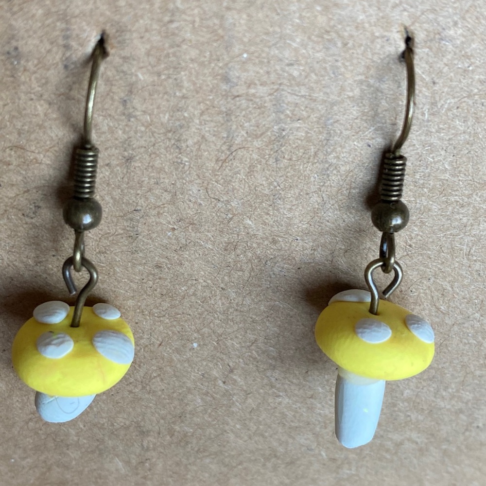Small yellow mushroom dangle earrings.